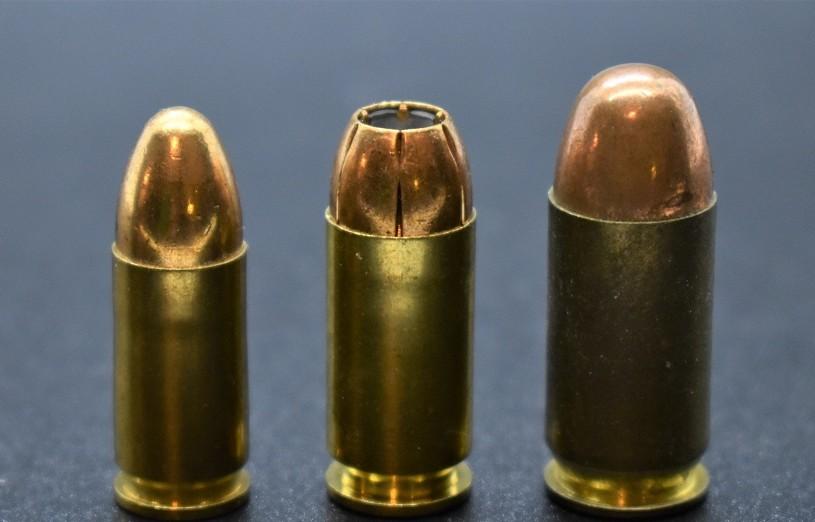 Hollow point personal defense round (center) compared to a full metal jacket. Training rounds will generally be FMJ because they're cheaper and will run consistently in most pistols.