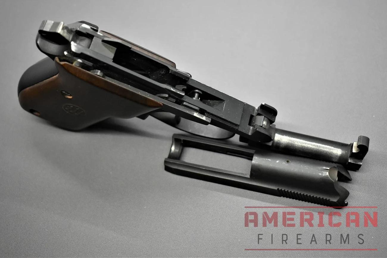 A close-up image of the Beretta Bobcat pistol's slide and frame, which have been disassembled for cleaning and maintenance.