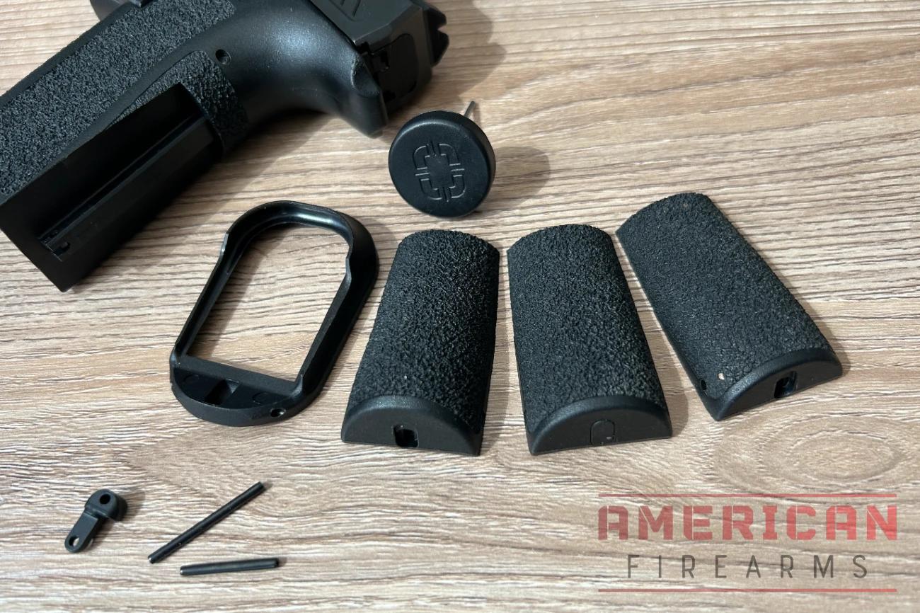 The High, Neutral, and Low backstraps are super easy to swap and try -- just push the retaining pin out with the included punch and slide a new one on.