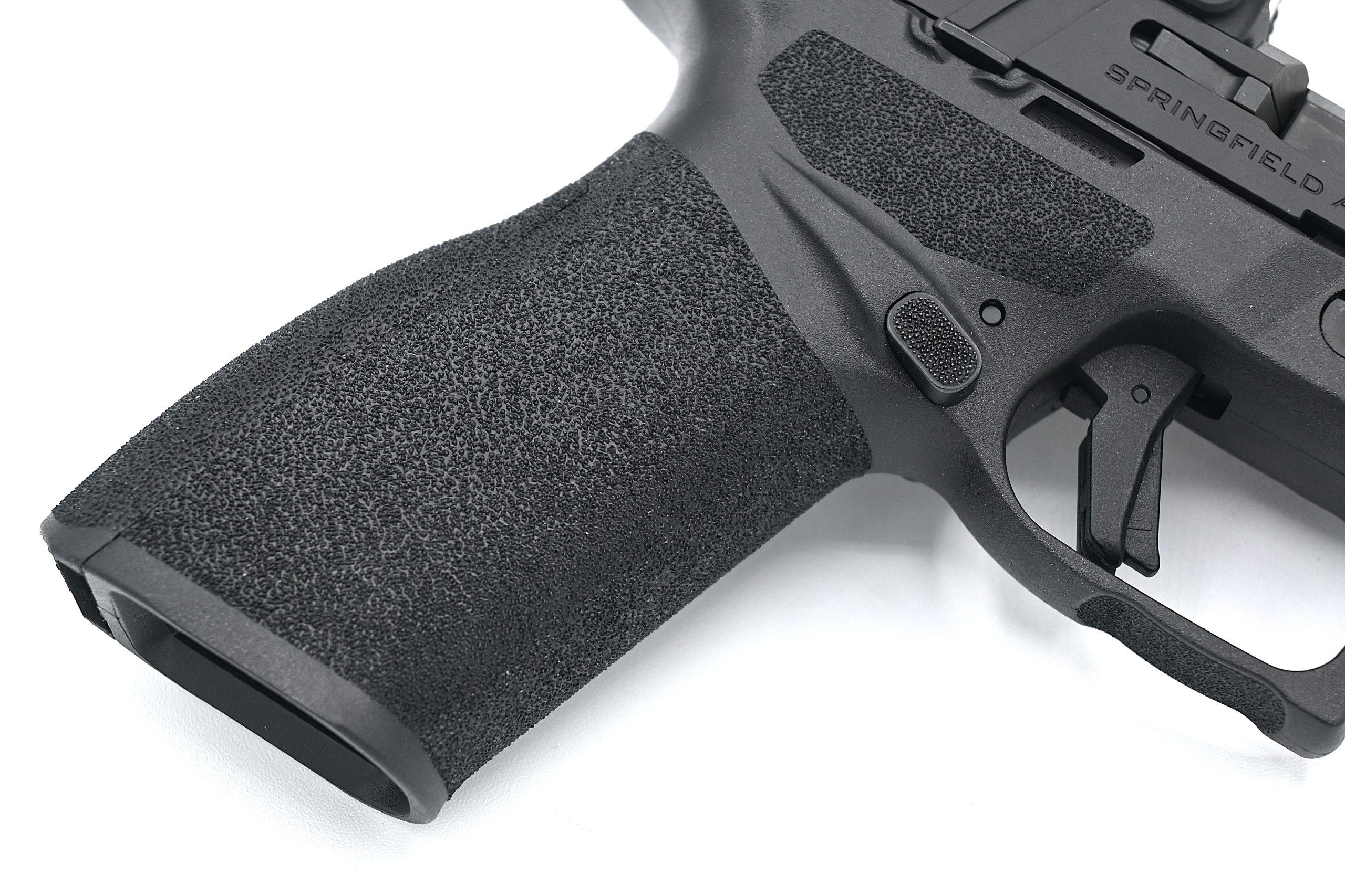 Caption: Springfield's Adaptive Grip Texture uses a staggered pyramid pattern that grips aggressively under recoil without abrading skin during extended carry.