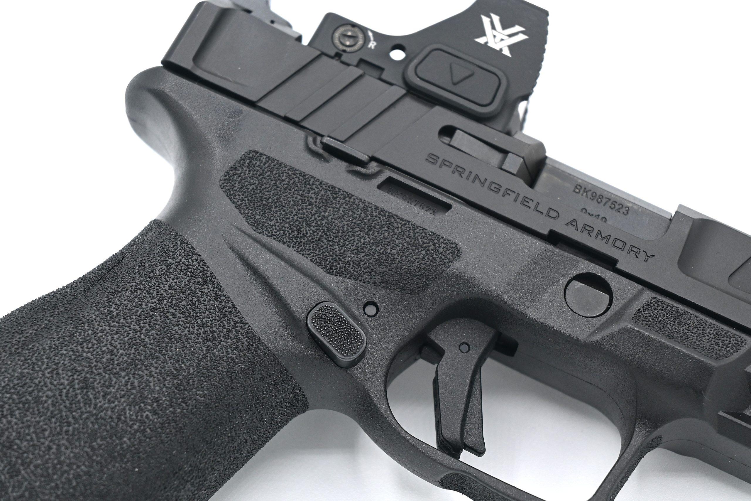 The Echelon's ambidextrous magazine release works from either side without swapping — the extended button shield prevents unintentional drops even with a full firing grip.