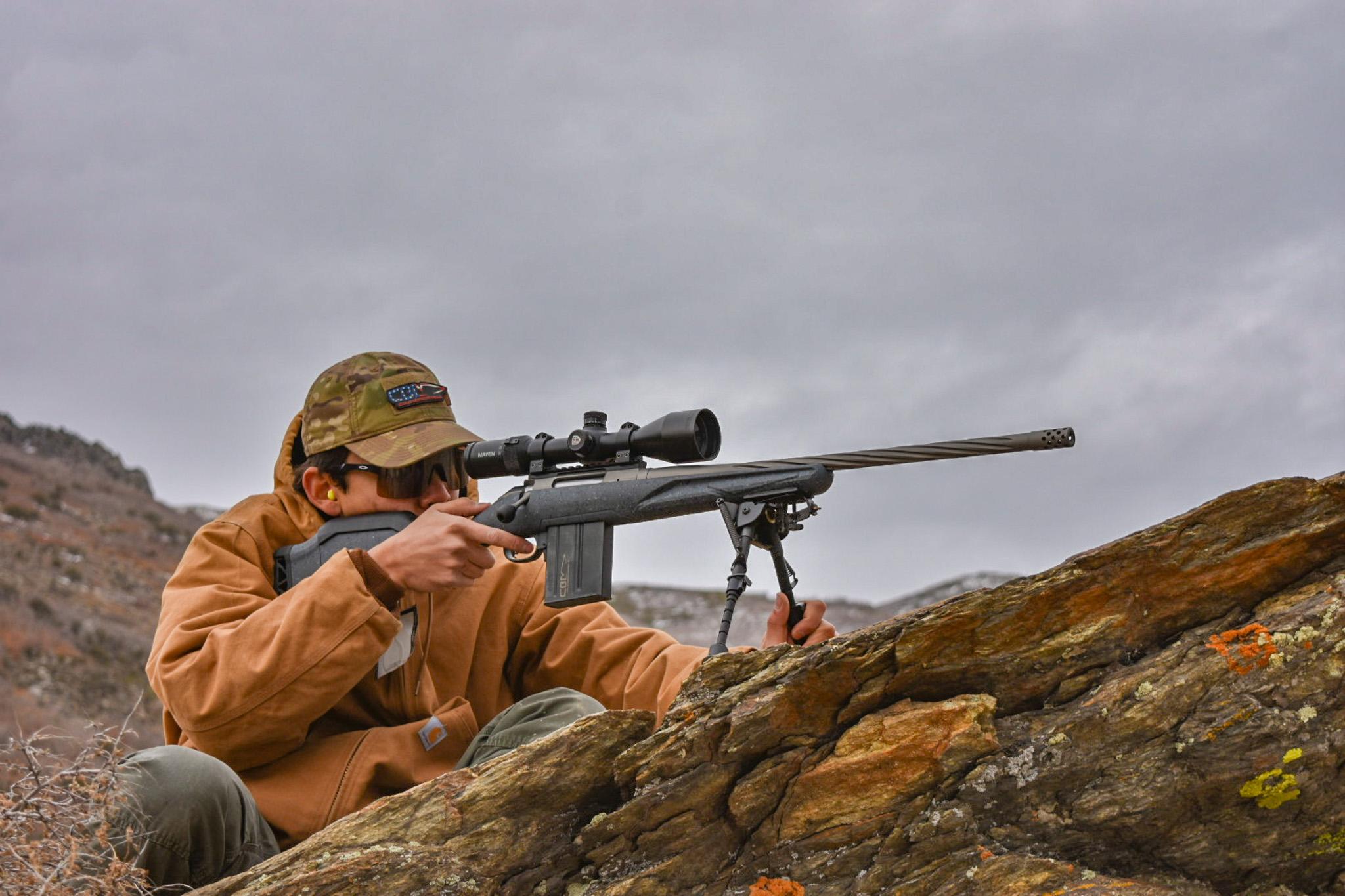 The Ruger American is ideal for trekking, and might save you enough money for a decent pair of boots.